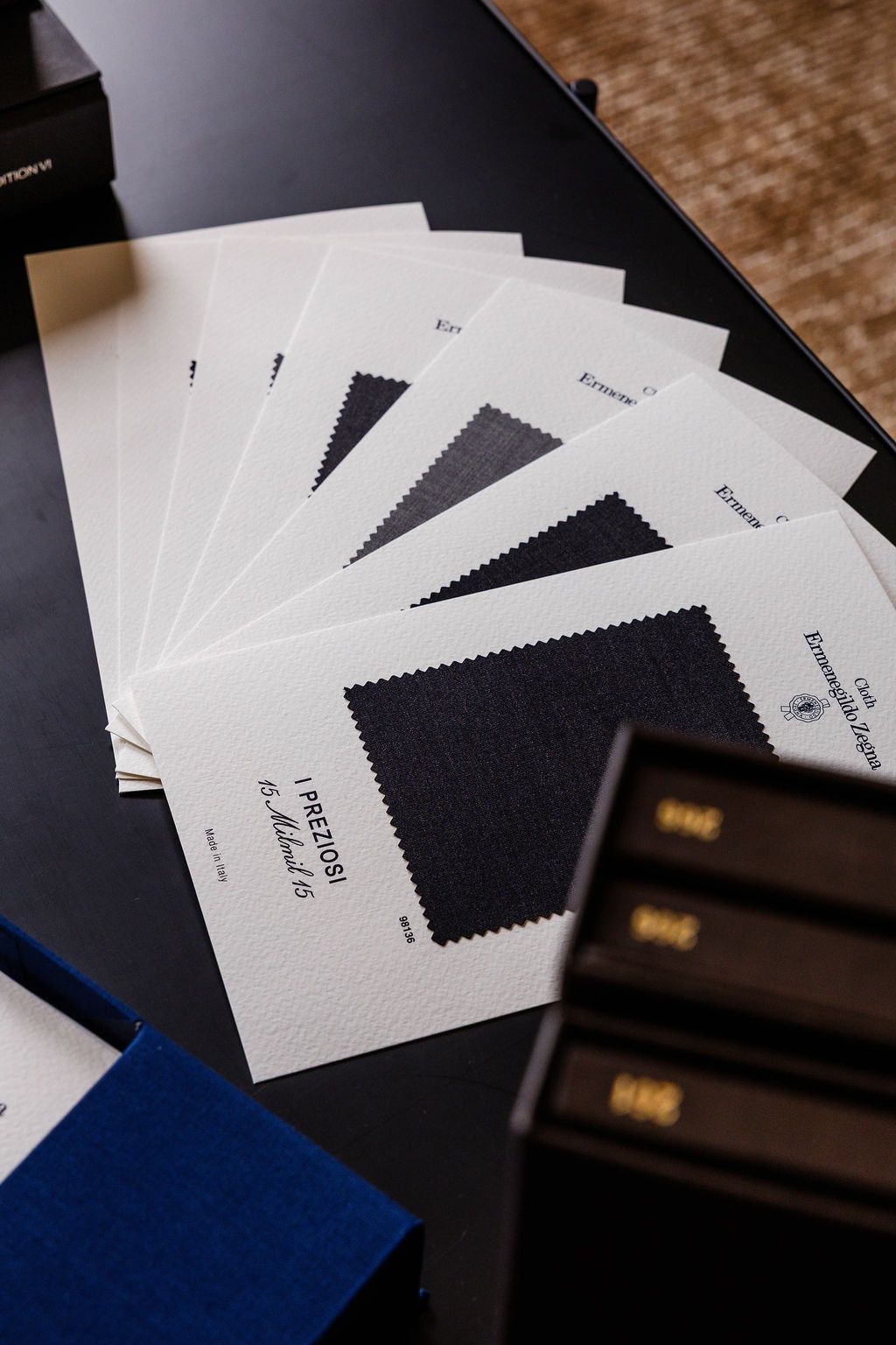 Close-up of luxurious fabric swatches fanned out on top of a table